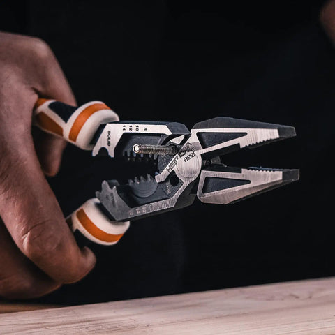Close-up of hands using Heavy Duty 8 In 1 Linesman Pliers For Electrical DIY Projects Wire Cutter Crimper Stripper Twist Deburr Winding.