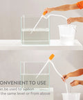 Luigi's Siphon Pump with orange handle and clear tubing, side view transferring water from tank to bucket.