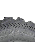 Close-up of tire tread showing Bearclaw EX 22x8x10 Front ATV UTV SxS Tires 6 Ply Aggressive All Terrain Tread With Rim Saver Technology