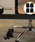 20 Piece Set of Durable Round Plastic Chair Wheel Sockets and Caster Inserts shown near office chair base