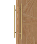 Side view of Titanium Gold Round Barn Door Handles For Dual Sided Pulls On Exterior Shower Doors And French Doors installed on wood door.