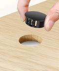 Plastic hole plug being inserted into wood surface from 200 Piece Plastic Hole Plug Set with 9 sizes for cabinets and furniture
