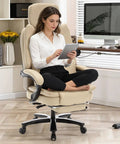 Woman seated on 500lbs Capacity Big And Tall Office Chair With Lumbar Support PU Leather Heavy Duty Reclining Chair With Foot Rest