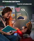 LED Clip On Reading Light With Dimmable Brightness, 3 Modes And 10 Levels illuminating a woman reading to a child in bed