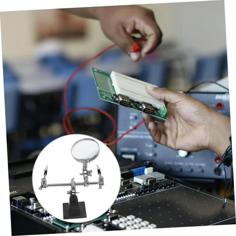 Hands using Adjustable Third Hand Soldering Station With Magnifying Glass And Dual Alligator Clips for PCB repair in electronics