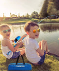 Two kids fishing by a pond with the Kids Fishing Pole Starter Kit With Tackle Box, Reel, Practice Plug and Travel Bag, enjoying outdoors.