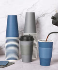 16 Oz Disposable Paper Coffee Cups With Lids, Sleeves, And Stir Sticks, Blue And Gray, 100 Pack, perfect for cafes, being filled with coffee