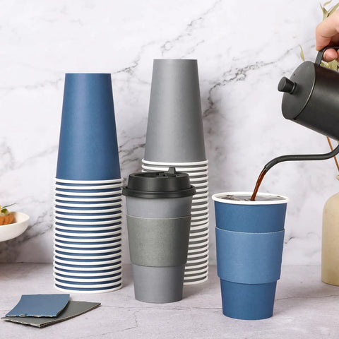 16 Oz Disposable Paper Coffee Cups With Lids, Sleeves, And Stir Sticks, Blue And Gray, 100 Pack, perfect for cafes, being filled with coffee