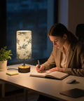 Cowboy Watercolor Decor Bedside Lamp With 3-Way Dimmable Touch Control And Built-In Charging Station on desk with woman writing
