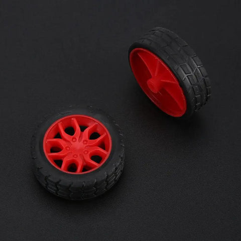 Plastic Crown Gear Set For DIY Robots And Toys, Motor Gear Kit with red plastic wheels and black tires on black background