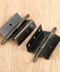 Antique Bronze Hinges Set For Wood Boxes And Cabinets, Vintage Style Door Hardware With 16 Screws, 8 Hole Crown Design displayed on wood