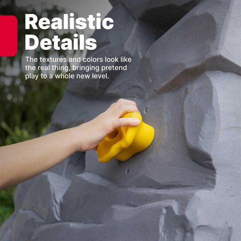 Hand gripping a yellow hold on the Skyward Summit Climbing Wall Playset For Kids Ages Four To Eight, realistic rock textures