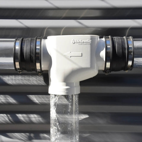 First Flush Rain Harvesting Diverter Kit with Catch All Tee for 4 Inch Round Pipes installed, diverting water.