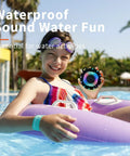 Child holding a Waterproof Shower Bluetooth Speaker With IPX7 Rating in a pool, demonstrating its outdoor use