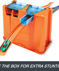 Deluxe Stunt Box Track Builder Playset With 25 Parts And A 1 To 64 Scale Vehicle on orange crash zone lid for stunts