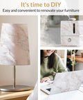 Slick Marble Peel And Stick Wallpaper on lamp, humidifier, and laptop.