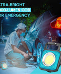 Go-To Mini COB Flashlight Keychain 1000 Lumens With 4 Modes shown illuminating a tire repair at night