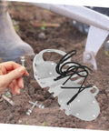 20 Pcs Lawn Aerator Shoe Spikes For Grass Aeration With Secure Fit kit on soil with hand holding metal peg