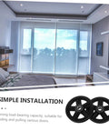 Kickass Heavy Duty Sliding Door Pulley Wheel Kit With Rigid Casters For Barn Door Track System displayed in a modern bedroom setting.