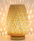 Dimmable Rattan Table Lamp With Boho Woven Shade And Bamboo Base Small Wicker Desk Lamp For Bedroom Living Room Nursery Kids Room Vintage Wooden Nightstand Light Inline Dimmer For Cozy Glow glowing on a table.