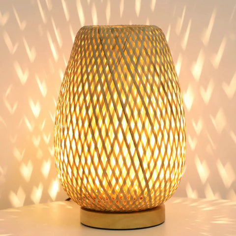 Dimmable Rattan Table Lamp With Boho Woven Shade And Bamboo Base Small Wicker Desk Lamp For Bedroom Living Room Nursery Kids Room Vintage Wooden Nightstand Light Inline Dimmer For Cozy Glow glowing on a table.
