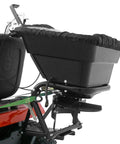 Side view of Tow Behind 12V Lawn Tractor Spreader for Grass Seed and Fertilizer with 80 pound capacity and lightweight frame attached to tractor.