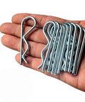 Hand holding Heavy Duty Hitch Pin Set With R Clip Spring Retaining Pins 10 Pcs Assortment In Steel Silver For Trailer Hitches