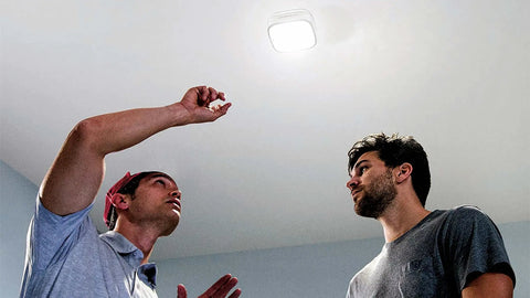 Two men installing Bright 1000 Lumens LED Garage Light With Quick Mount And No Fuss Setup Ceiling Or Wall Mount App Control And Scheduling