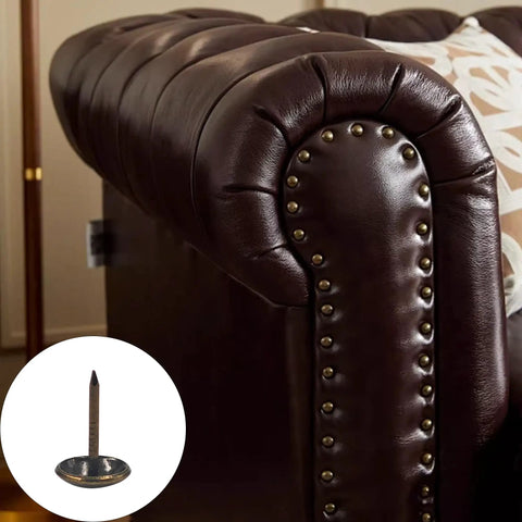 Top Shelf Pro Pack 11mm Round Head 17mm Pin Upholstery Tacks Bronze Decorative furniture nails on brown leather sofa arm.