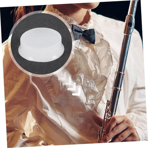 Close-up of Transparent Silicone Flute Plugs And Open Hole Key Caps Kit for easy tone tweaks, shown with flute setup.