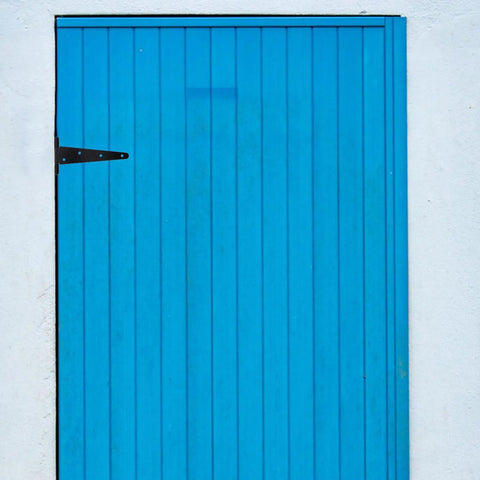 Beefy 8 Inch Black Iron Barn Door Hinges Extended T Shape Slotted Bearing Hinge on a blue door for sturdy installations