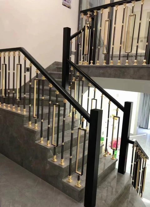 Solid Heavy Duty Adjustable Black Square Aluminum Deck Balusters And Stair Railing Spindles, 8 Pack with gold accents on indoor staircase.