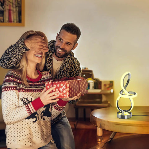 Couple enjoying a surprise with Modern Spiral Music Note Table Lamp With 7 RGB LED Colors Touch Control Dimmable Nightstand Light