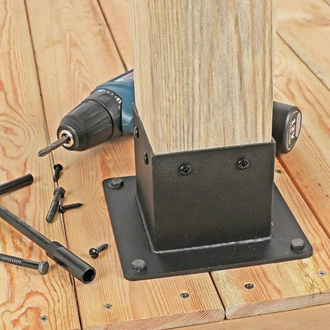 Beefed Up Heavy Duty 4x4 Post Base Bracket Set With 3.3 By 3.5 Inch Inner Size installed on wooden deck with mounting holes visible