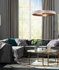 Sleek Dope Modern Gold Circular LED Pendant Light Fixture With Adjustable Chain, 16 Inch Diameter in living room setting