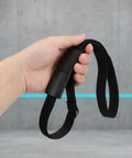 Hand holding a Sectional Sofa Connectors With Hook And Loop Straps, Nonskid Linking Bands For Modular Couches, Tables And Chairs.