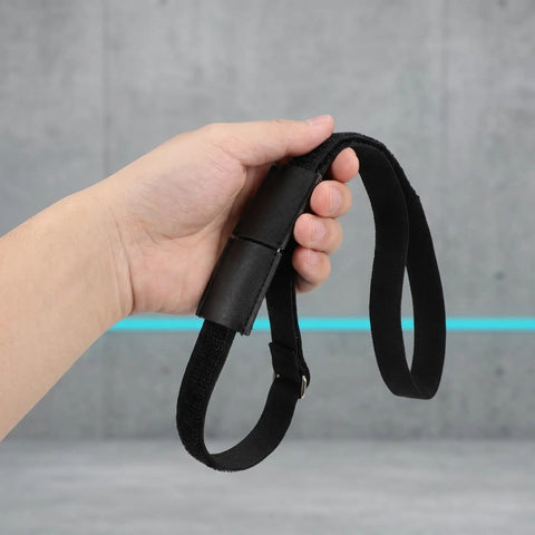 Hand holding a Sectional Sofa Connectors With Hook And Loop Straps, Nonskid Linking Bands For Modular Couches, Tables And Chairs.