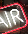 "AIR" neon sign in white and red glow, detail view with fluffy background, showcasing vibrant design