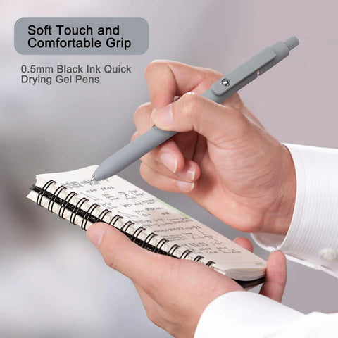 Close-up of hand writing in notebook with Go To Gel Pens Set Five Premium Retractable Gel Pens With Quick Dry Ink Fine Point Smooth Black Ink