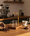 Sleek Pour Over Coffee Stand With Aluminum Dripper Holder And Solid Wood Base For Manual Brewing Stations on a kitchen counter