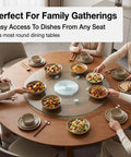 Workhorse Tempered Glass Lazy Susan Turntable on dining table with dishes and people, perfect for family gatherings.