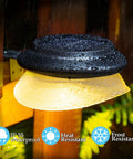 Solar Fence Lights Six Pack With 9 LED Warm White Outdoor Waterproof UFO Design mounted on fence in rain, glowing warm light