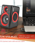 Usb Powered Pc Speakers With Deep Bass, 2.0 channel stereo for desktops, plug and play design next to a laptop on desk.