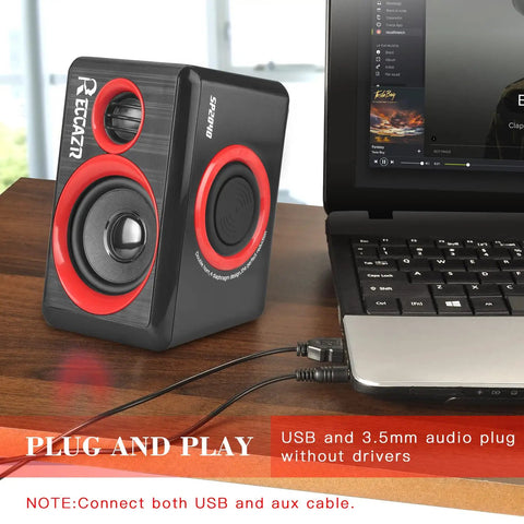Usb Powered Pc Speakers With Deep Bass, 2.0 channel stereo for desktops, plug and play design next to a laptop on desk.