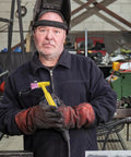 Man in gloves holding pink TIG welding torch with sturdy ceramic nozzle, showcasing Rock Solid Pink Tig Welding Cups That Make Cleaning A Breeze.