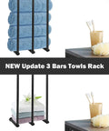 Three-bar towel rack with stacked blue towels and bathroom toiletries on countertop.