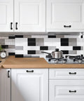 3 Inch Square Cabinet Pulls In Matte Black Arch Design for kitchen cabinets and drawers, installed on white cabinetry in modern kitchen