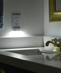 Two Pack MotionLight Built In Wall Plate LED Night Lights For Duplex Outlets With Auto On Off Sensor illuminating bathroom sink
