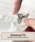 No Slip Comforter Clips For Duvet Covers 4 Pack Keeps Blanket From Bunching Or Shifting While You Sleep close-up of hand attaching clip