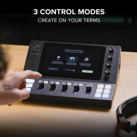 Person using Creator XS Adaptive Digital Mixer for Podcasting and Streaming with touchscreen displaying control modes